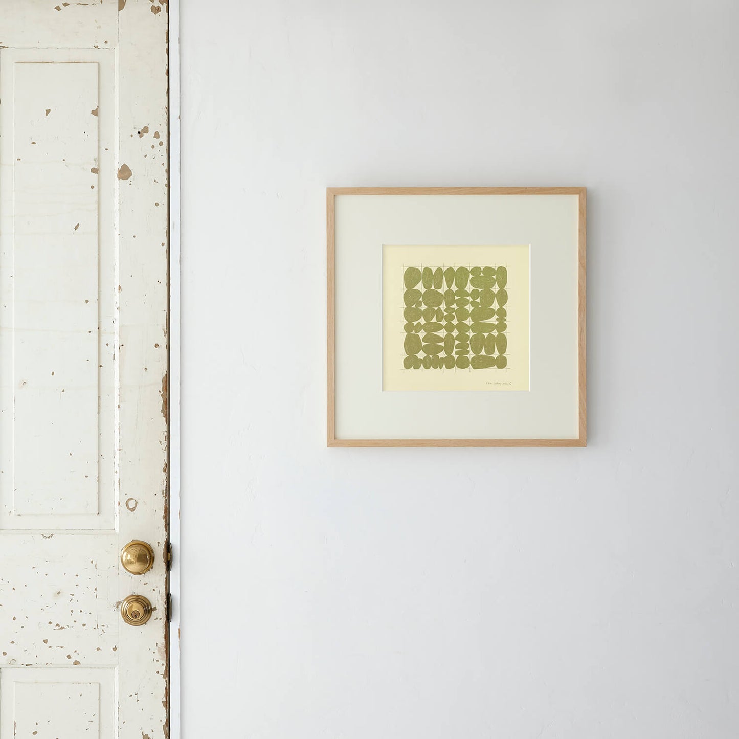 Stones Grid (green) frame 50+ with matting.